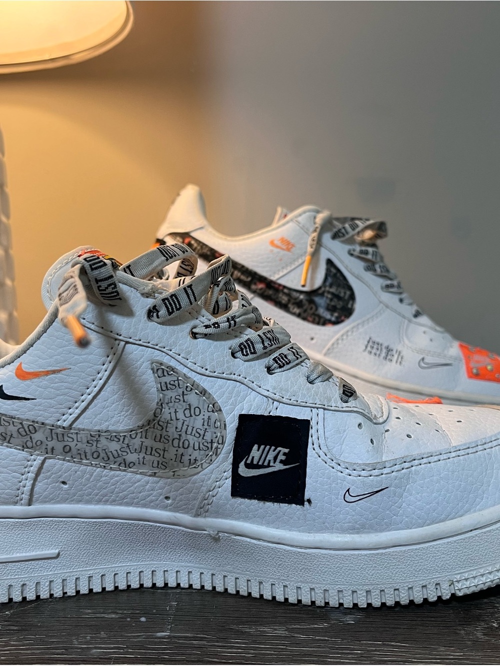 Nike Women's White Low-Top Sneakers with Black Logo and Orange Accents